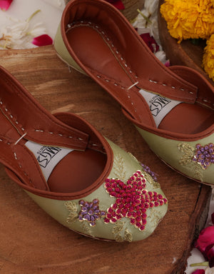 Pistachio green Punjabi jutti for women with pink sequin flowers