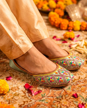 Mint green Punjabi jutti for women with multicolor embroidery