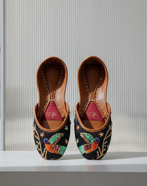 Black embroidered Punjabi jutti for women with colorful bird motif