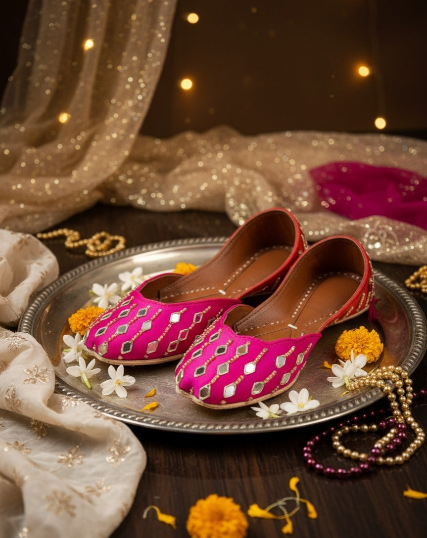 Close-up of hot pink jutti with mirror-style diamond embellishments
