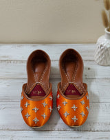 Orange Punjabi jutti for women with silver embellishment